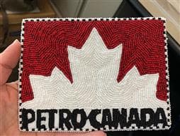 A Petro-Canada logo made by Didi Grandjambe using traditional Dene beadwork techniques