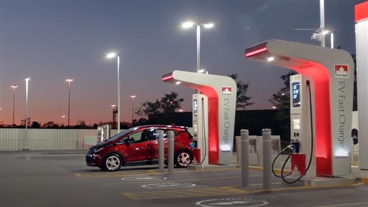 A car charges at a Petro-Canada EV fast charger.