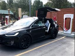 David’s Tesla at a Tesla charging station