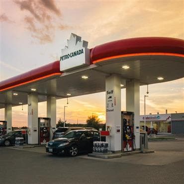 A Petro-Canada gas station at dusk.