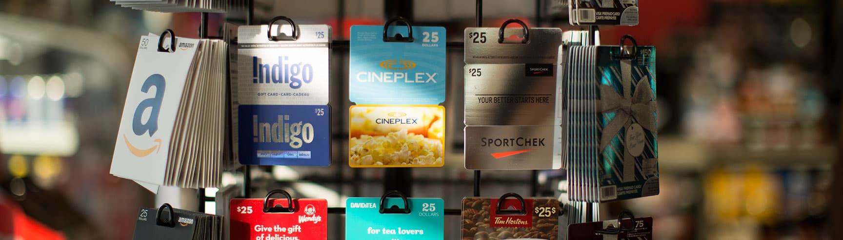 A rotary display of gift cards in a Petro-Canada store.