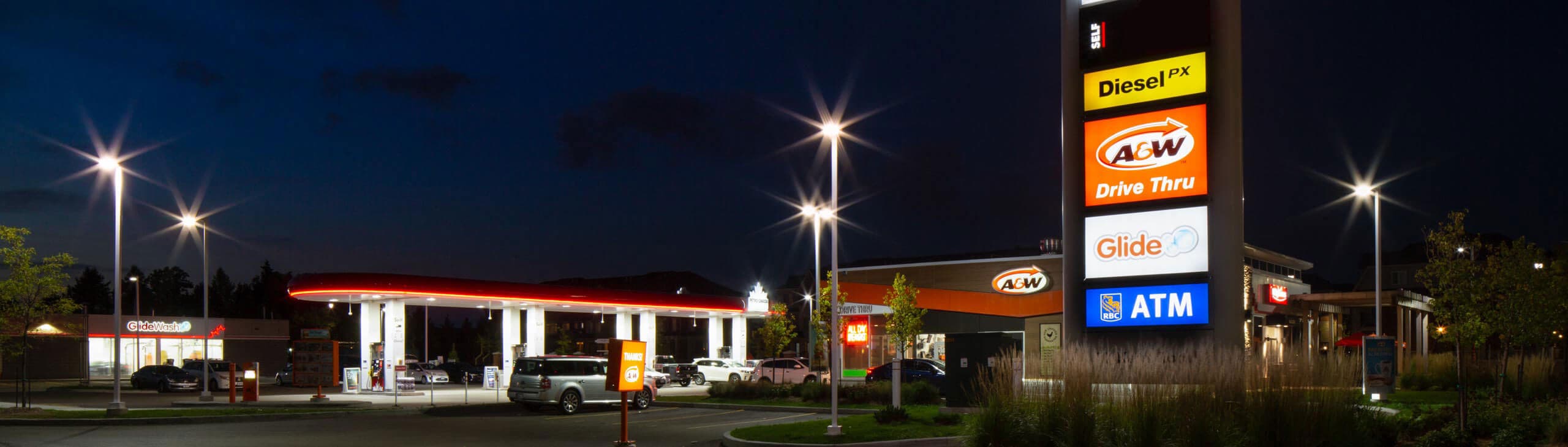 A Petro-Canada gas station at night.